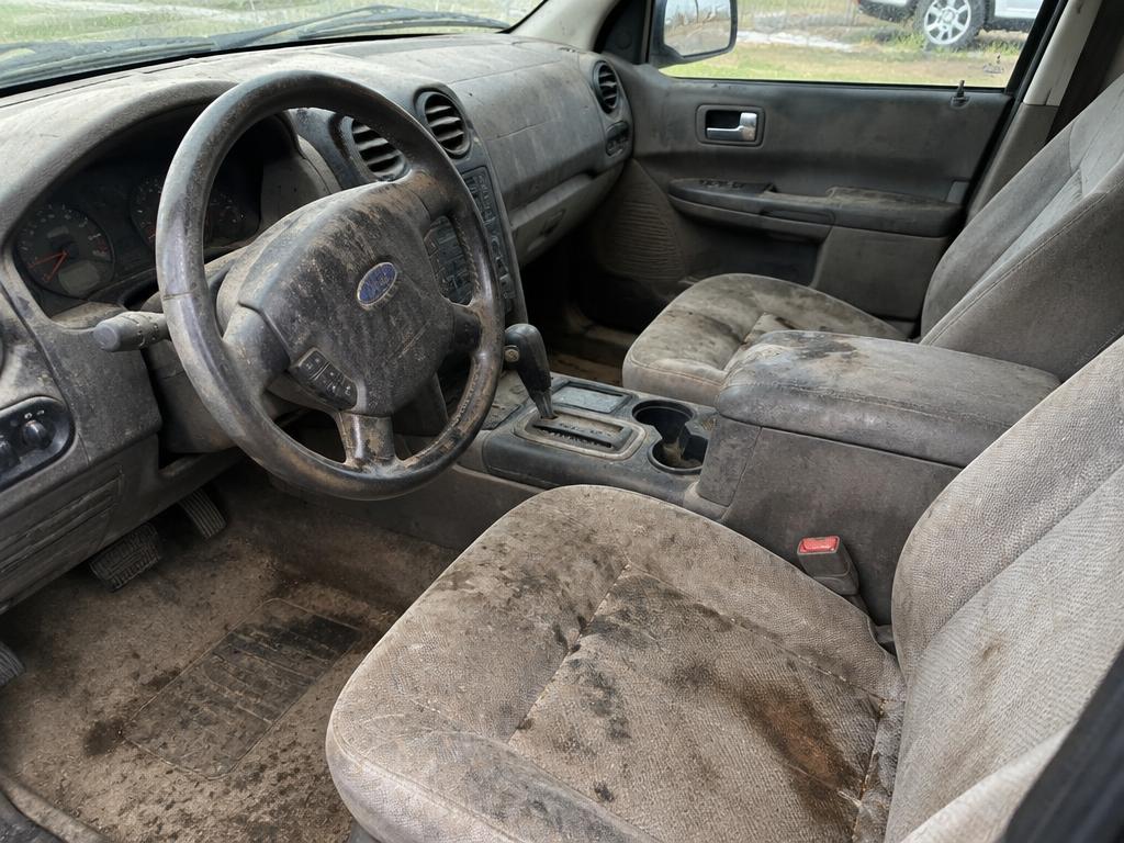 Stained, dirty car interior before detailing